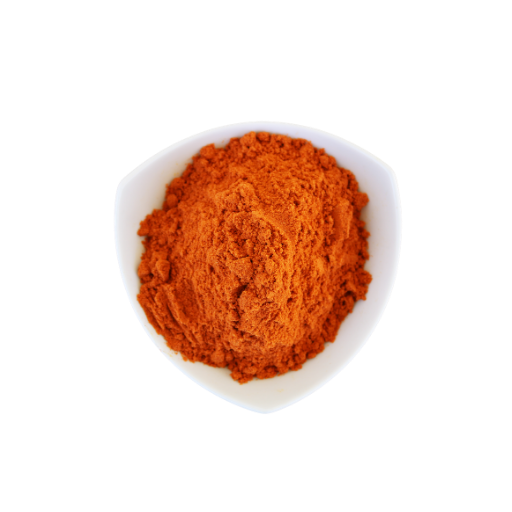 Red powder in a white bowl on a white background