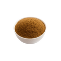 White bowl filled with brown powder on a white background
