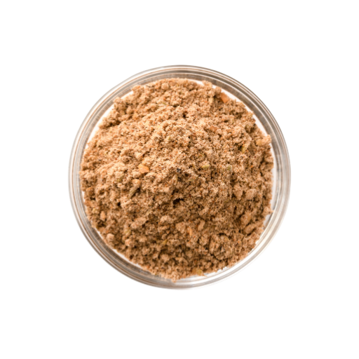 Brown powder in a clear glass container on a white background