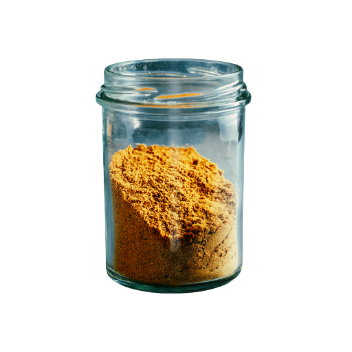 Clear glass jar filled with a yellow powder on a white background