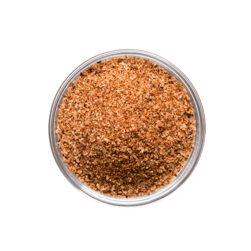 Clear container filled with a brown spice mix on a white background