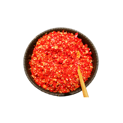 Red spice in a black bowl with a wooden spoon on a white background